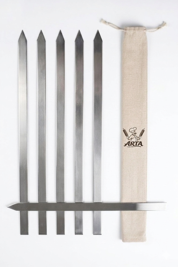 A set of six Arta Persian kabab skewers laid out with the branded canvas pouch